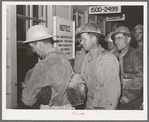 Construction workers being paid off. Shasta Dam, Shasta County, California