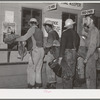 Construction workers being paid off. Shasta Dam, Shasta County, California