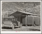 Home of construction worker at Shasta Dam. Summit City, California. Notice that the trailer has been incorporated into the house
