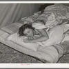 Daughter of carpenter in her tent home. Mission Valley, California, which is about three miles from San Diego. She was in the second year of high school in Louisiana, but she is not attending school in California