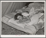 Daughter of carpenter in her tent home. Mission Valley, California, which is about three miles from San Diego. She was in the second year of high school in Louisiana, but she is not attending school in California