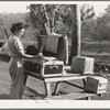 Carpenter's wife unpacking a trunk. Mission Valley, California, which is about three miles from San Diego