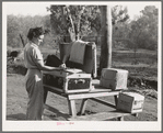 Carpenter's wife unpacking a trunk. Mission Valley, California, which is about three miles from San Diego