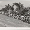 Workmen during lunch period, across the street from the Consolidated Airplane Factory. San Diego, California