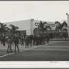 Workmen entering Consolidated Aircrafts early in the morning. San Diego, California