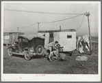 Automobile and trailer parked in trailer court. These belong to a carpenter's helper who is from the Rio Grande Valley. He owns his home in the valley, has done farm work and public work there. His family is with him in Corpus Christi where he is now working at the naval air base
