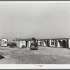 Tourist court showing the sanitary facilities building. Corpus Christi, Texas. These tourist courts are now filled with workmen from the naval air base