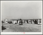 Tourist court showing the sanitary facilities building. Corpus Christi, Texas. These tourist courts are now filled with workmen from the naval air base