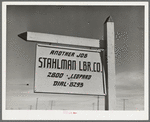 Lumber company sign. Corpus Christi, Texas. Naturally all forms of construction work are on the increase in the town