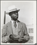 Workman at the naval air base. Corpus Christi, Texas. Notice his identification badge which allows him to enter base. Picture taken on Sunday