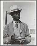 Workman at the naval air base. Corpus Christi, Texas. Notice his identification badge which allows him to enter base. Picture taken on Sunday