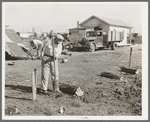 Man working on foundation for new house in cheap residential section of Corpus Christi, Texas. Many cheap houses are now being built to satisfy the demand of workmen and their families for housing