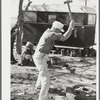 Truck driver repairing tire. Corpus Christi, Texas