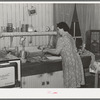 Wife of farmer in her kitchen. Auburn, California. Notice the electric stove, running water and radio. Electrification has been general in this section for twenty years