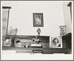 Ornaments on top of piano in living room of fruit farmer. Placer County, California. These farmers have had a very high living standard. Center figure is award this farmer's daughter helped win in polo match