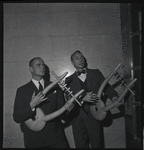 George Balanchine and Lincoln Kirstein, both holding lyres from Orpheus.