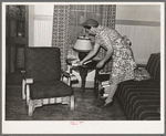 Fruit farmer's wife in her living room. Placer County, California