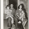 Young man, his wife and children. They came from Oklahoma with his father and mother