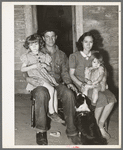 Young man, his wife and children. They came from Oklahoma with his father and mother