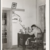 Son of Japanese fruit farmer at his desk. Placer County, California