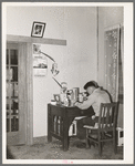 Son of Japanese fruit farmer at his desk. Placer County, California