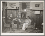 Fruit farmer and his wife in their living room. Placer County, California. These people have raised fruit on four hundred acres for twenty-five years but because of changed market conditions are now heavily in debt to the Federal Land Bank