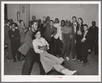 Negro swinging his girl on roller skates. Savoy Ballroom, Chicago, Illinois