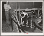 Setting up the pins in Negro bowling alley. Chicago, Illinois