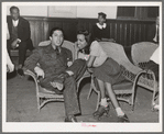 Couple talking at roller skating rink of Savoy Ballroom. Chicago, Illinois
