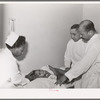 Examining baby at clinic of Negro hospital. Chicago, Illinois