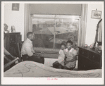 Front room of apartment rented by Negroes. Ida B. Wells Housing Project can be seen through the window. Chicago, Illinois