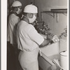 Doctors scrubbing up before operation. Negro hospital, Chicago, Illinois
