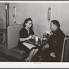 Policeman talking to employee of Ten-cent store whose trade is predominantly Negro. Chicago, Illinois