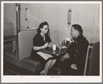 Policeman talking to employee of Ten-cent store whose trade is predominantly Negro. Chicago, Illinois