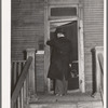 Doctor entering home of relief family. Chicago, Illinois