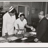 Clinic patient receiving instruction card at municipal tuberculosis sanitarium. Chicago, Illinois