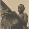 Boy selling Afro-American newspaper, Harlem, New York