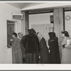 Patients at clinic paying bills. Chicago, Illinois