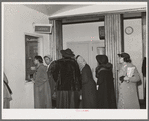 Patients at clinic paying bills. Chicago, Illinois