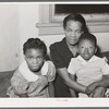 Mother with her children at home. Chicago, Illinois