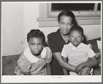 Mother with her children at home. Chicago, Illinois