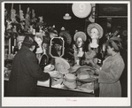 Buying hats in ten-cent store which caters to Negroes. Chicago, Illinois