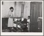 Corner of kitchen of apartment rented to Negroes. Chicago, Illinois