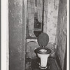 Toilet in home of family on relief. Chicago, Illinois