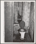 Toilet in home of family on relief. Chicago, Illinois
