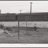 Spring gardening adjacent to railroad tracks in Negro section of Chicago, Illinois