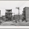 Children playing in vacant lot in Negro section of Chicago, Illinois