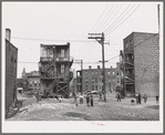 Children playing in vacant lot in Negro section of Chicago, Illinois