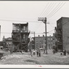 Children playing in vacant lot in Negro section of Chicago, Illinois