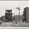 Children playing in vacant lot in Negro section of Chicago, Illinois